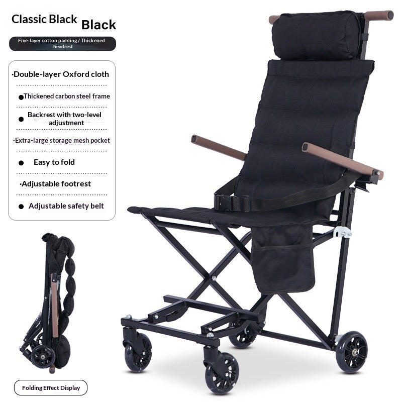 Black folding medical transport chair with a padded headrest, adjustable safety belt, armrests, and four wheels, shown on a white background with feature callouts and a folded view inset.